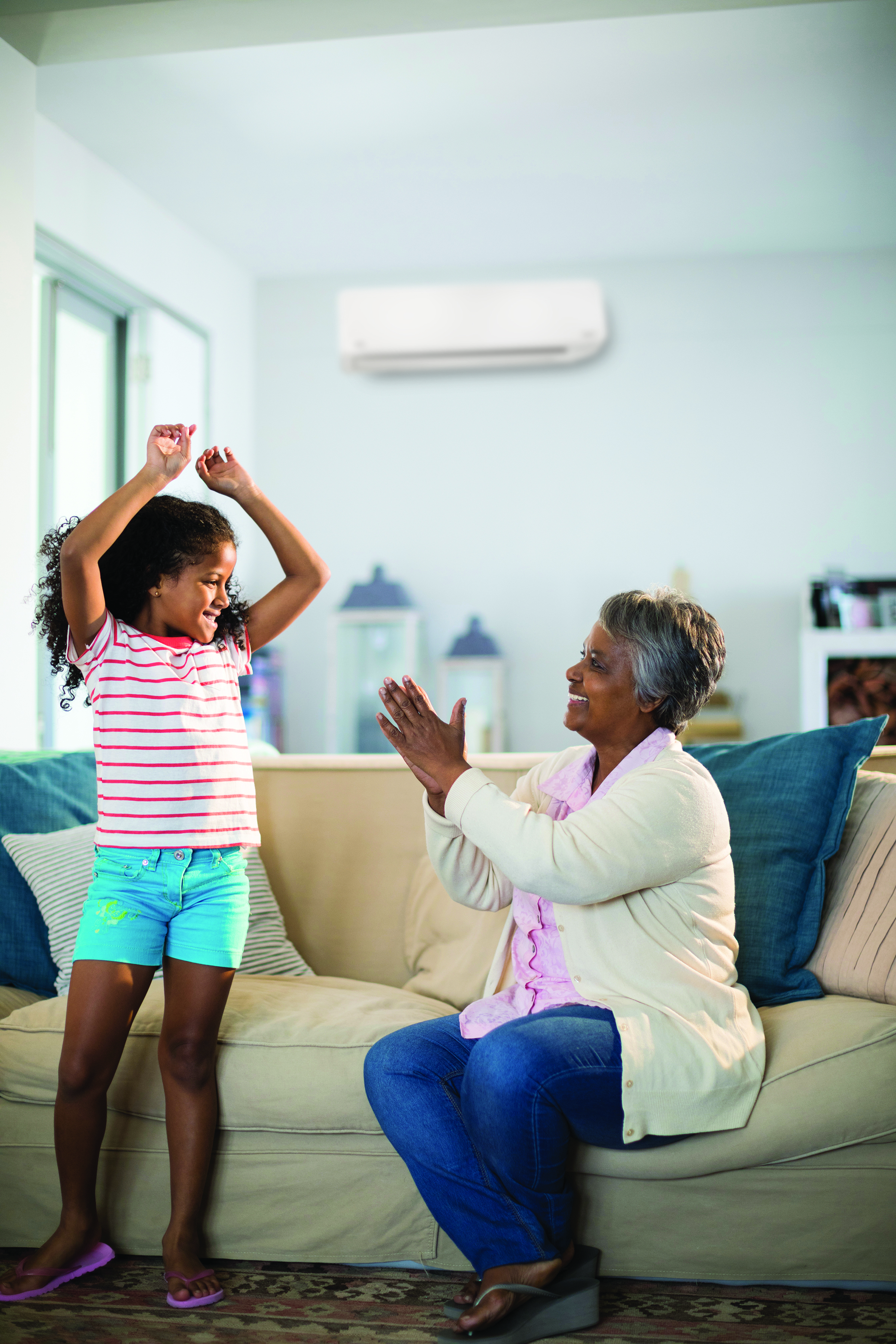 Family enjoying year-round comfort of a ductless mini-split heat pump