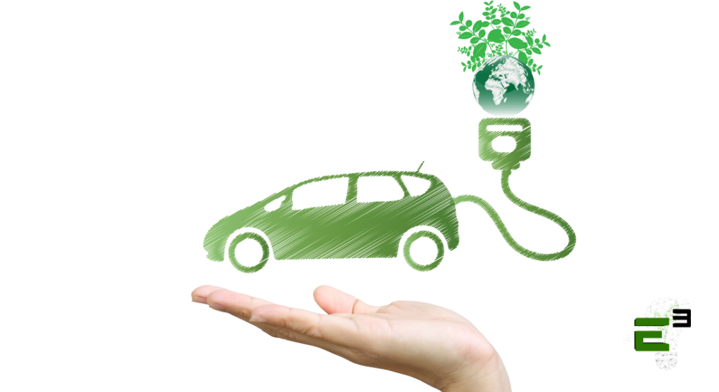 Hand holding an electric and ecological car