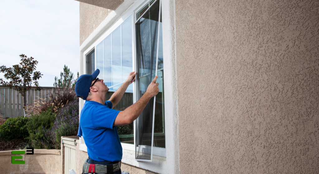 Man installing thermal break windows at home